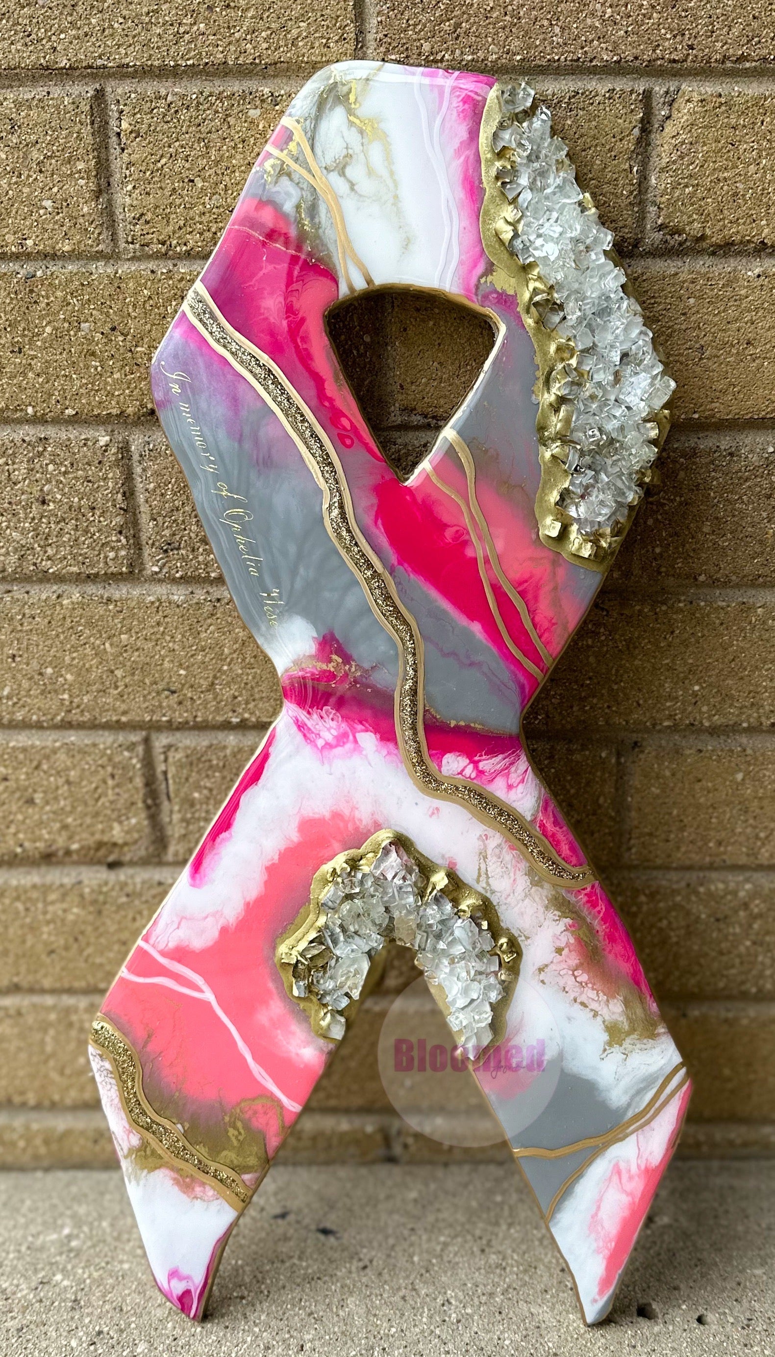 A wooden resin breast/brain cancer ribbon